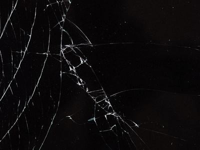 Cracked glass against a black background