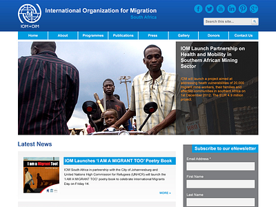 IOM Homepage blue clean flat grey homepage non profit simple website