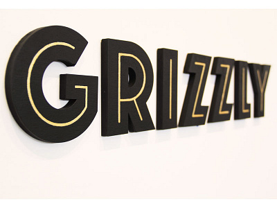 Lasercut Logotype for Grizzly Brewing Co. gold grizzly lasercut logo logotype plywood signage.