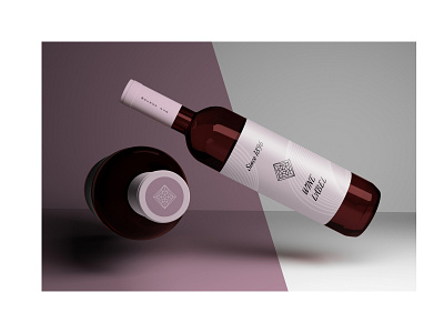 Stationery mockup with wine bottles flying over surface.