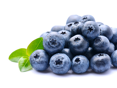 Sweet blueberries with leaves on white backgrounds. Healthy food