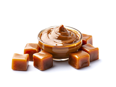 Caramel candy with caramel topping on white backgrounds.