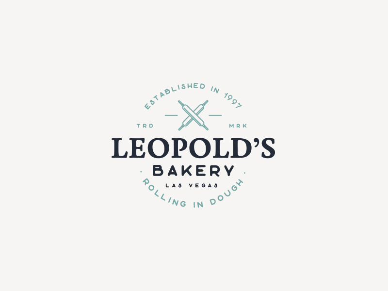 Leopold's Rolling In Dough Bakery artisan baker food cafe blue rustic vintage rolling pin logo bakery