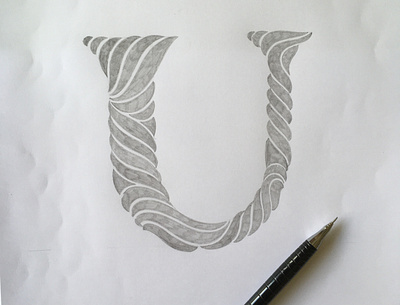 U flourishes lettering script