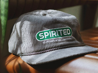 Spirited Cap 02 badge brand branding design embroidery green hat hat design illustration logo portland oregon spirited texture type vector