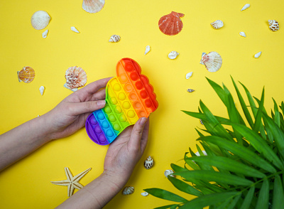 Anti-stress toy in the hands of a girl design