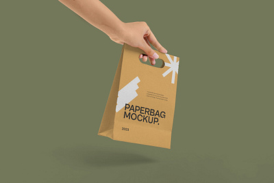 Hand Holding Paperbag Mockup hand merchandise