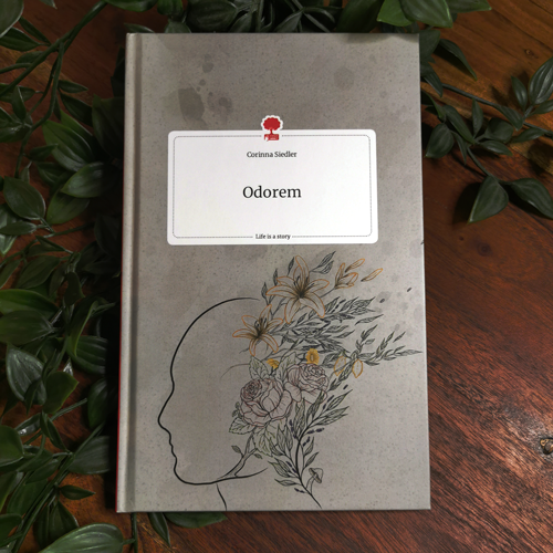 Book Cover with flowers coming out of a head, representing the blooming memories