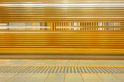 the urban commute gold train platform photograph abstract abstract frame gold metal photography platform shining speed station train urban commute