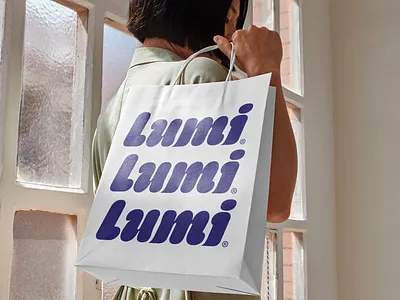 Lumi Ice Cream Logo Design bag branding bubbly design graphic design ice cream icon logo mark model purple sweet type typography