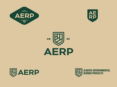 AERP Logo (Rejected) alberta branding environment graphic design lockup logo logotype mountains recycling rubber shield tires treads wordmark