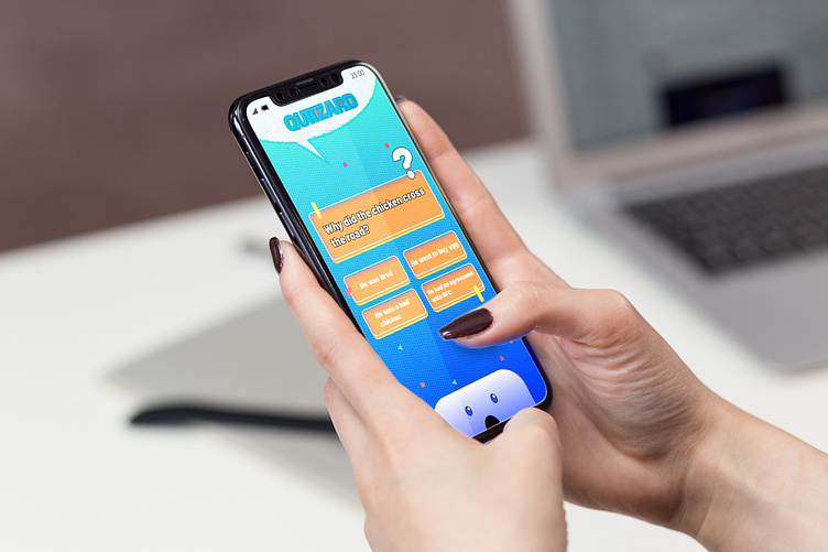 A mockup of the quiz game, showing a female hand playing quiz.