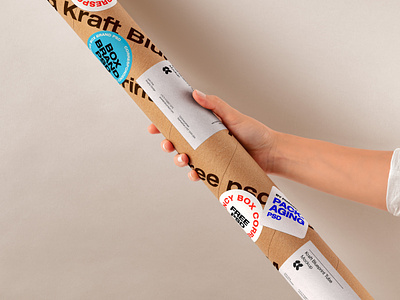 Free Hand Holding Kraft Tube Psd Mockup packaging mockup tube mockup