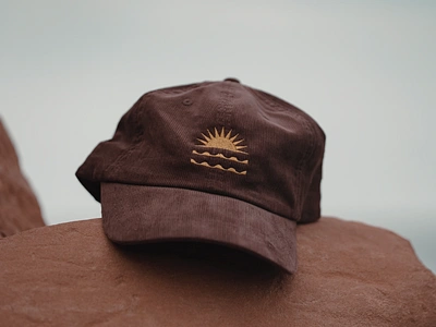 Horizon Badge - Gold & Brown Corduroy Hat apparel badge baseball cap branding embroidered embroidery hat design horizon logo minimal logo ocean badge outdoors patch sun sun badge travel waves