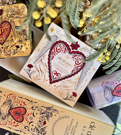 • CLÉ DE PEAU BEAUTY UNLOCK THE HEART COLLECTION • gold heart illustration lines packaging
