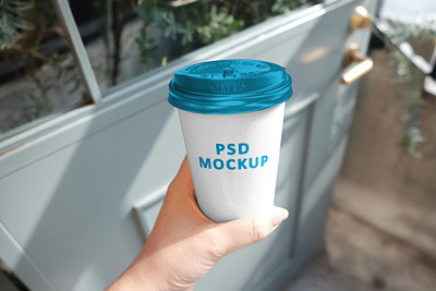 Hand Holding Disposable Cup Mockup branding cup design cup mockup disposable cup mockup free mockup freebie mockup mockups