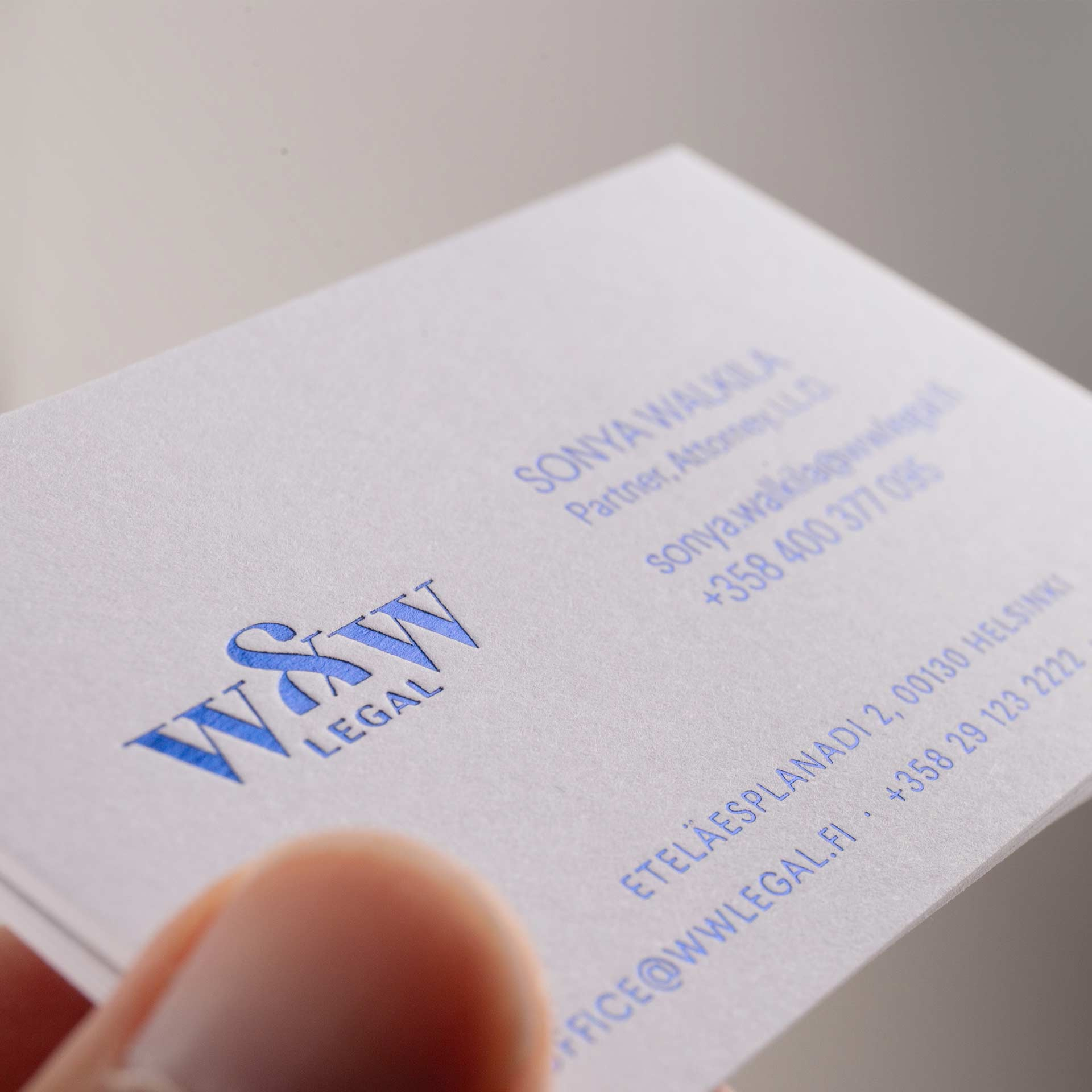 Blue foil on white card business card classic logo classy deboss design finland emboss foil heidelberg identity law firm letterpress logo muato nordic design spotcolor