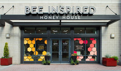 Honey House Graphics exterior graphic design honeycomb large format retail signage storefront window