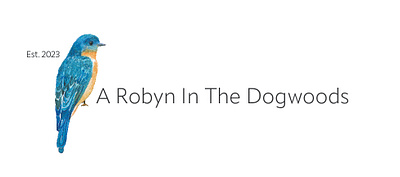 A Robyn In The Dogwoods Logo graphic design logo