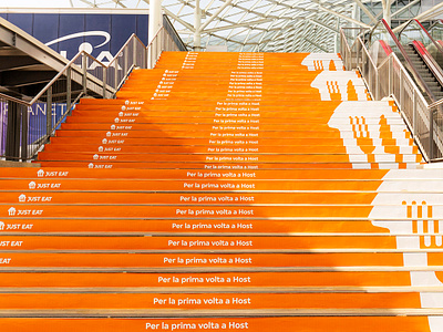 Just Eat at HostMilano: Scaling New Heights ad advertising brand design branding concept dtp graphic design logo ooh orange outdoor print stairs steps stripes wrapping