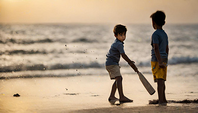 Boy's Playing Cricket beach cricket cricketball cricketbat match sealink tennis