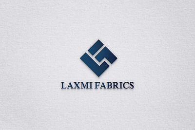 Elevating Style: Logo Reimagining for Laxmi Fabrics designcommunity