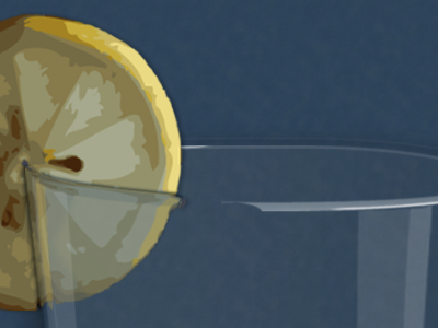 Lemon wedge on the rim of a highball glass