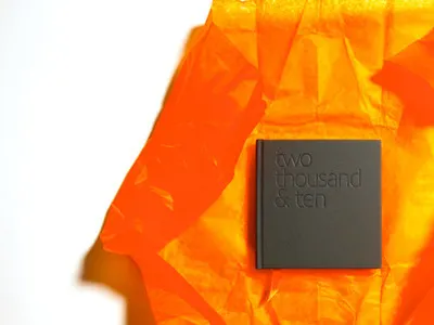 two thousand and ten book brochure design design embossing gray guildford print design self promotion surrey tangerine tissue paper typography