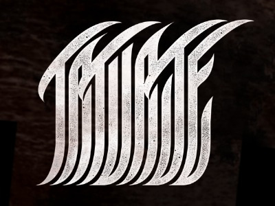 It says Tatuaje logotype merch tatuaje