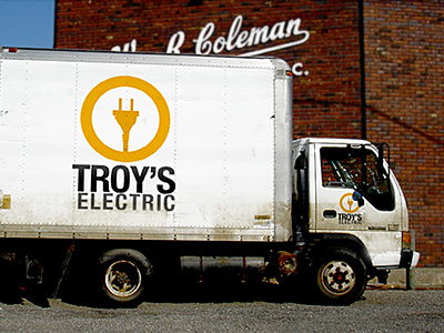 Troy's Electric Truck logo mockup truck yellow