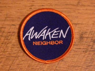 Awaken Neighbor Patch custom font logo orange patch purple thread trade gothic extended type typography white