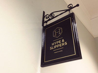 Hype & Slippers Studio Sign black brand branding gold hanging sign id identity logo pub sign wall wood