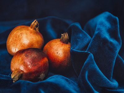 Pomegranates blue fine art fruit photograph photography red velvet