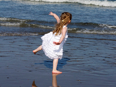 Dancing in the Surf beach children photography portrait summer