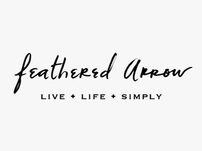 Feathered Arrow hand type handwritten logo script type typography