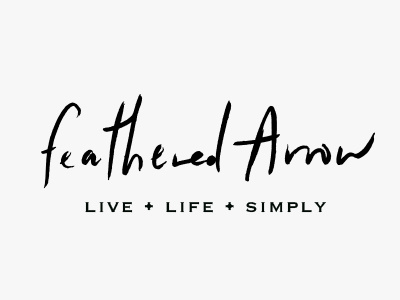 Feathered Arrow hand type handwritten logo script type typography