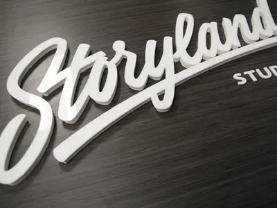 Storyland Studios calligraphy lettering logo sign signage