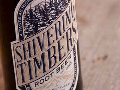 Shivering Timbers Root Beer alchohol beer beverage bottle drink illustration label mountains packaging root beer