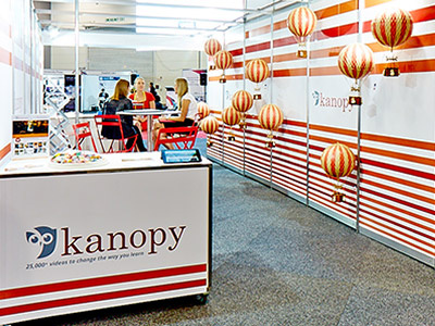 Kanopy Conference Setup balloons conference design library owl poster wall