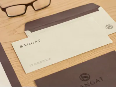 Photo of Stationery | Sangat | Wellness Centre and Spa brand business card envelope invitation letterhead logo design print design sangat spa stamp stationery wellness
