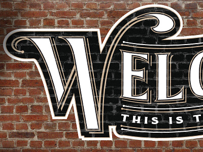 Welcome, This is the back way in. brick champagne paint sign signage