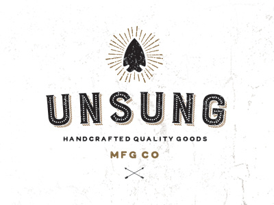 Unsung Mfg Co arrowhead branding distressed gold identity logo texture typography vintage