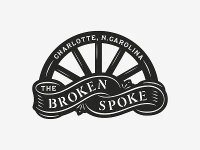 The Broken Spoke broken spoke logo sign stencil wagon wheel