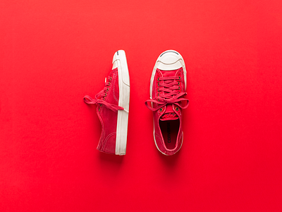 Photograph of red shoes converse jack purcell laydown lightroom photograph red shoes sneakers