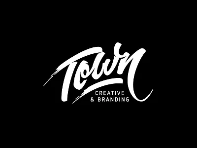 Town brush pen calligraphy cursive hand drawn lettering logo vector