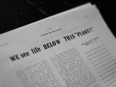 below THIS "planet" black and white letraset lettering typography