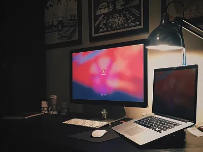 Working Late apple desk lamp home office monitors office prints work space working