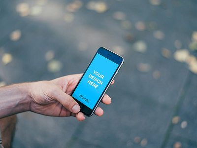 Man holding black iPhone 6S in the street freebie iphone mockup online placeit smartmockups template tool