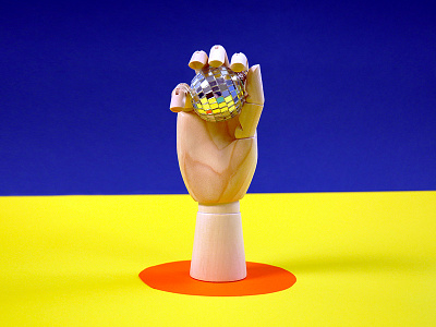 Hand Holding Disco Ball disco disco ball hand photography wood yellow