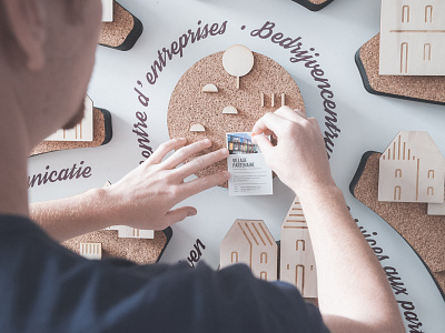 Interactive mural brussels business center cork graphic design interaction interior design laser cut mural wood